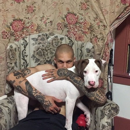 A picture of Delroy Edwards with his dog.